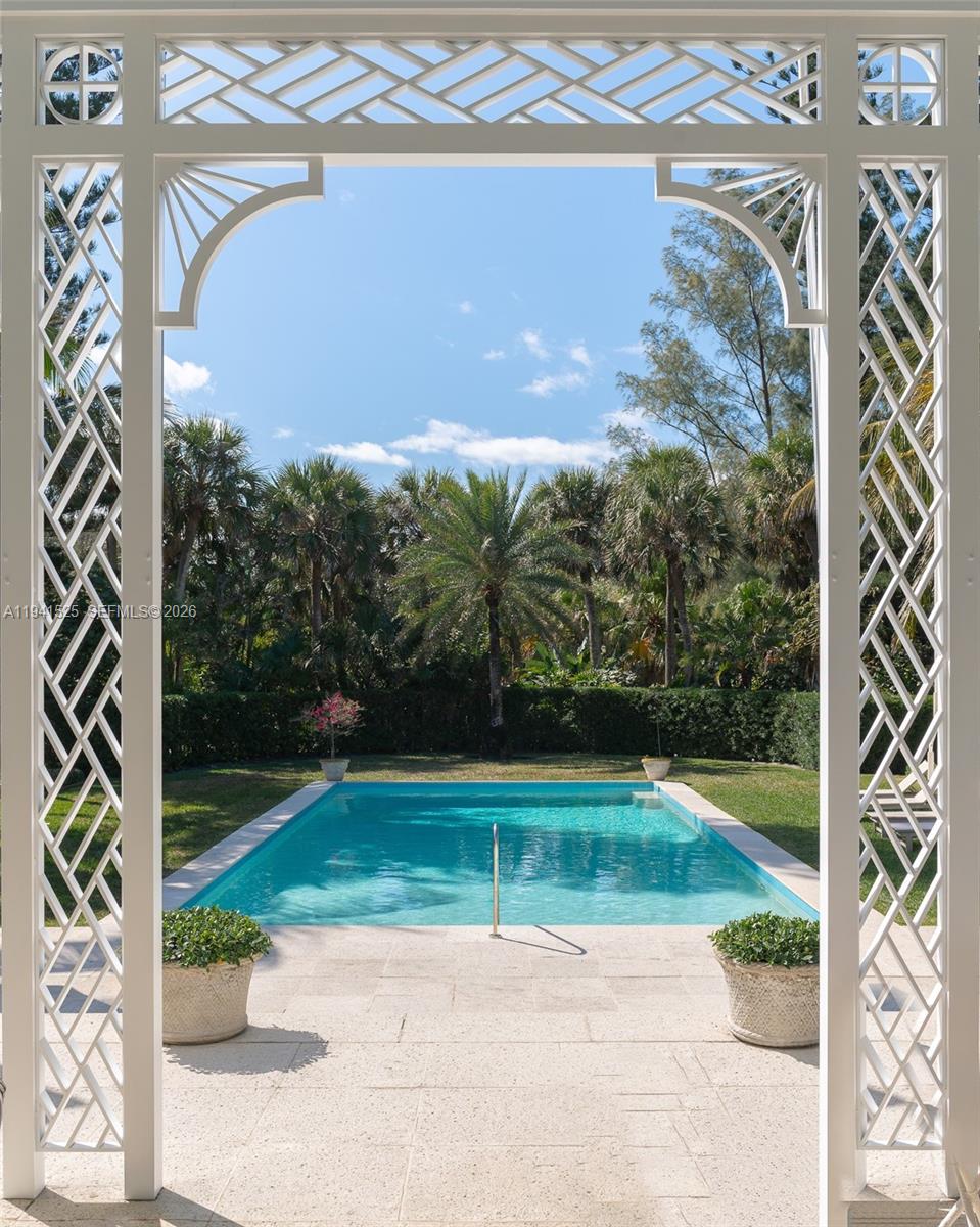 21 South Beach Road Jupiter Island, FL 33455 - Photo 8 of 45 a view of a garden with a pathway
