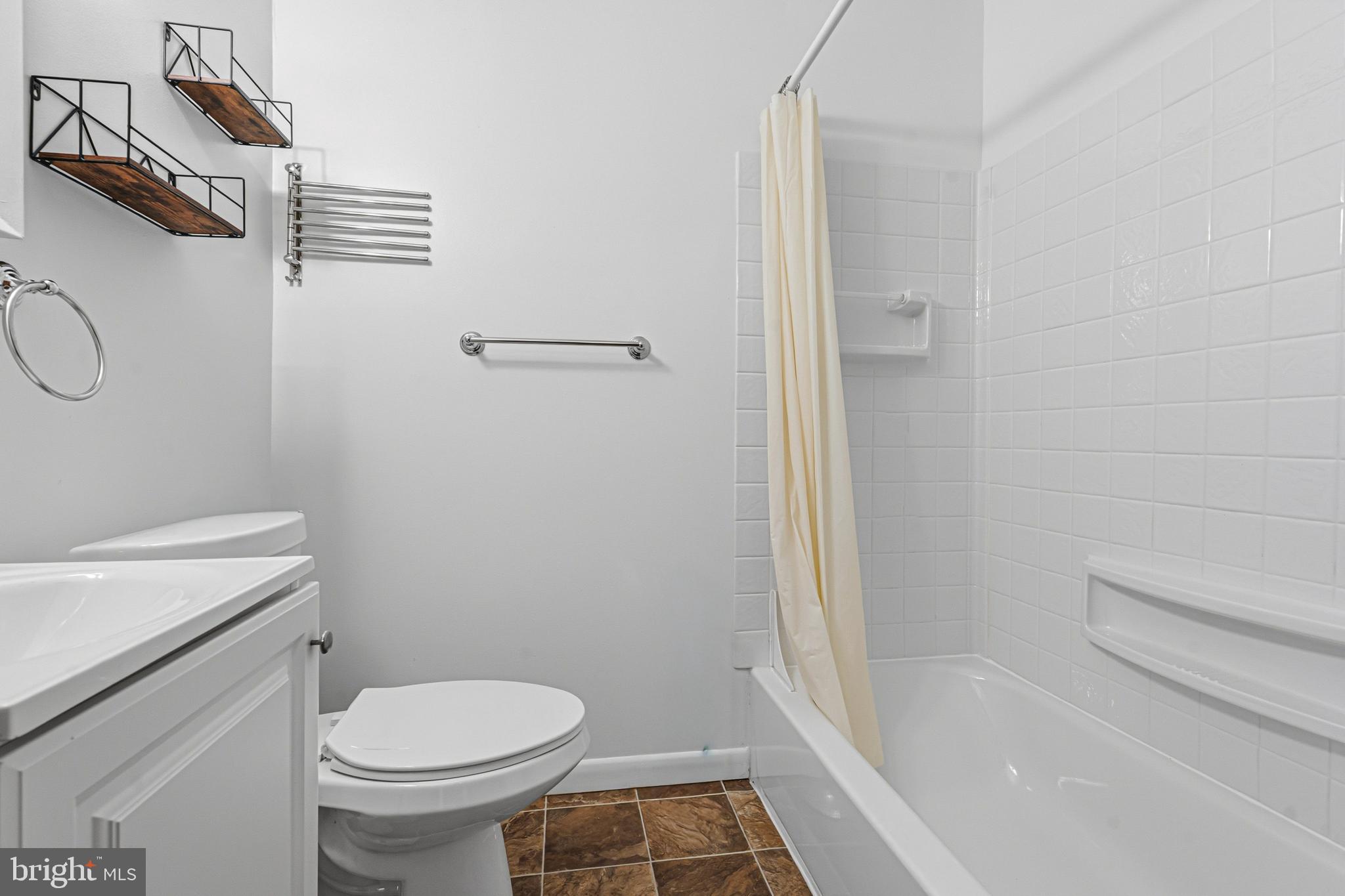 1242 Delbert Avenue Baltimore, MD 21222 - Photo 15 of 34 a bathroom with a sink and a toilet