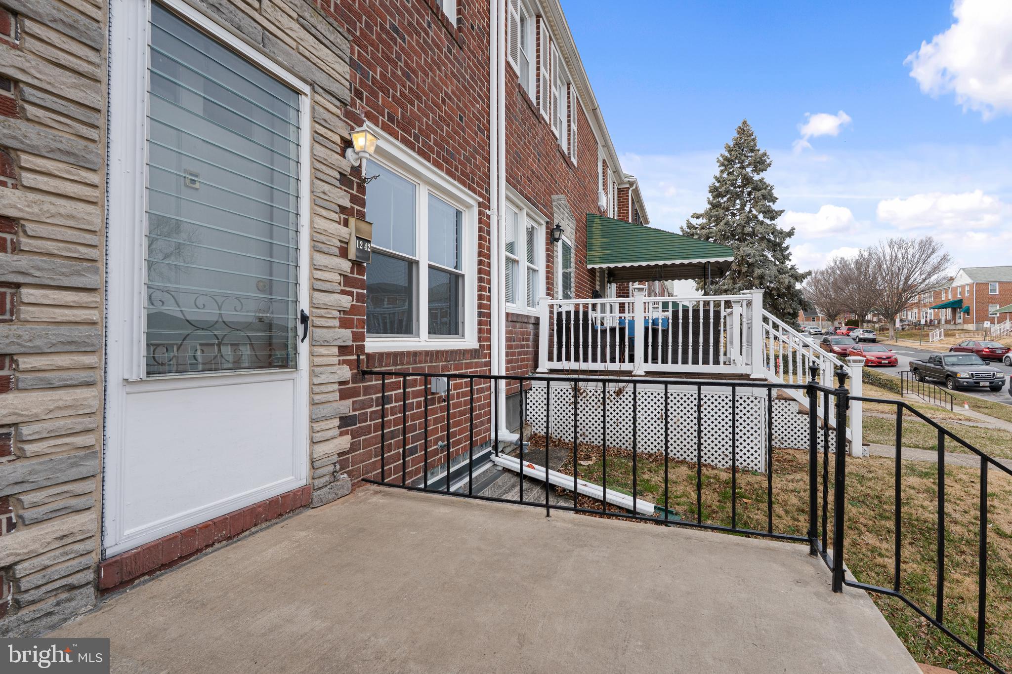 1242 Delbert Avenue Baltimore, MD 21222 - Photo 24 of 34 a view of a house with iron fence