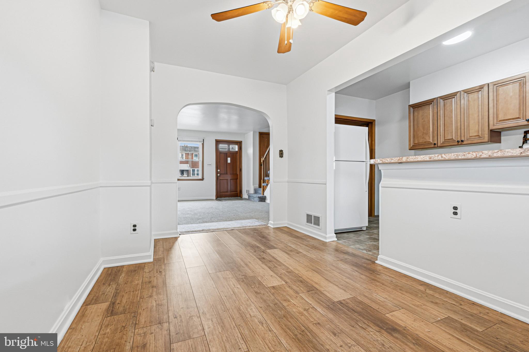 1242 Delbert Avenue Baltimore, MD 21222 - Photo 5 of 34 wooden floor in an empty room with a window