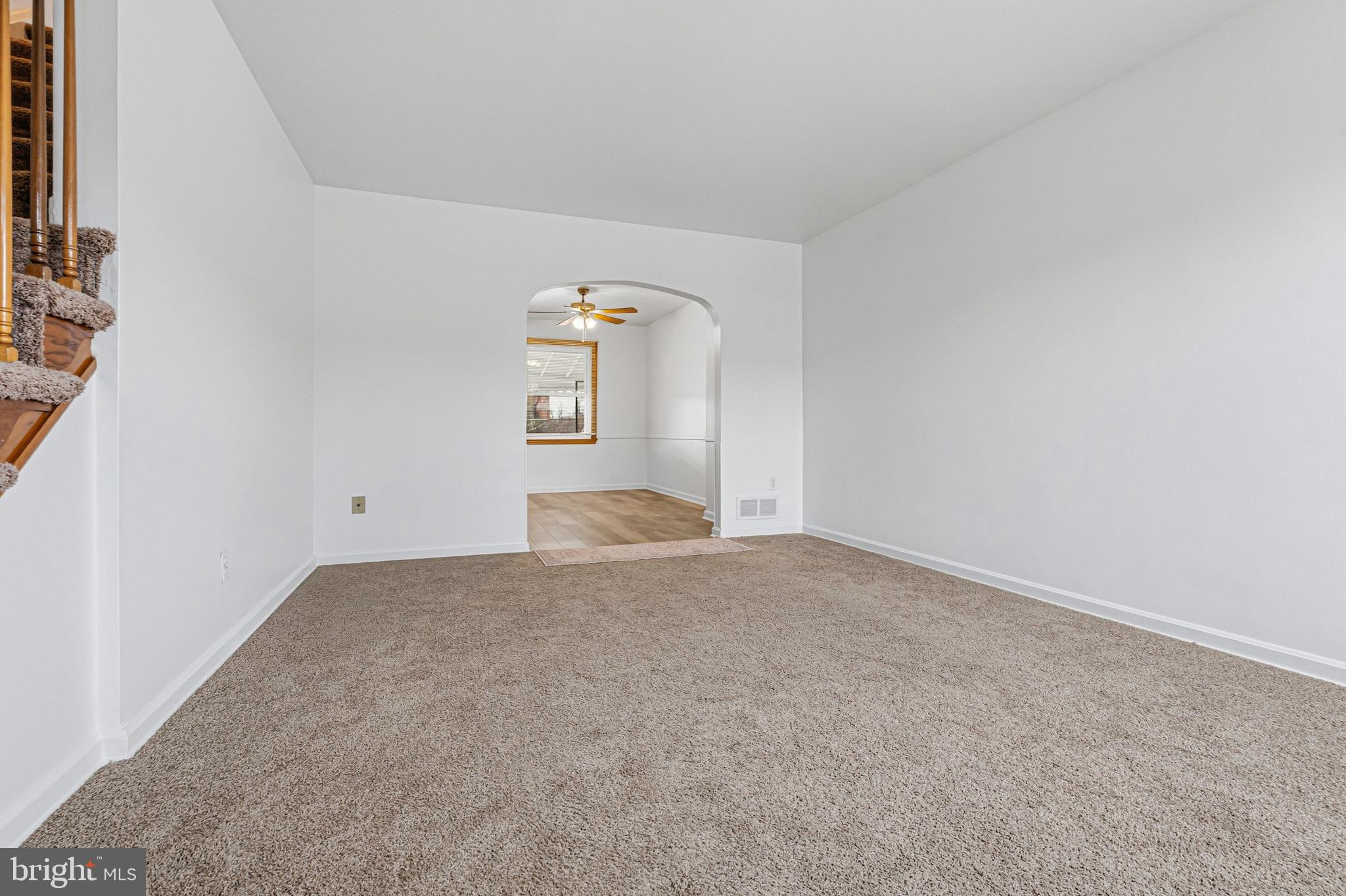 1242 Delbert Avenue Baltimore, MD 21222 - Photo 9 of 34 an empty room with a empty space and windows