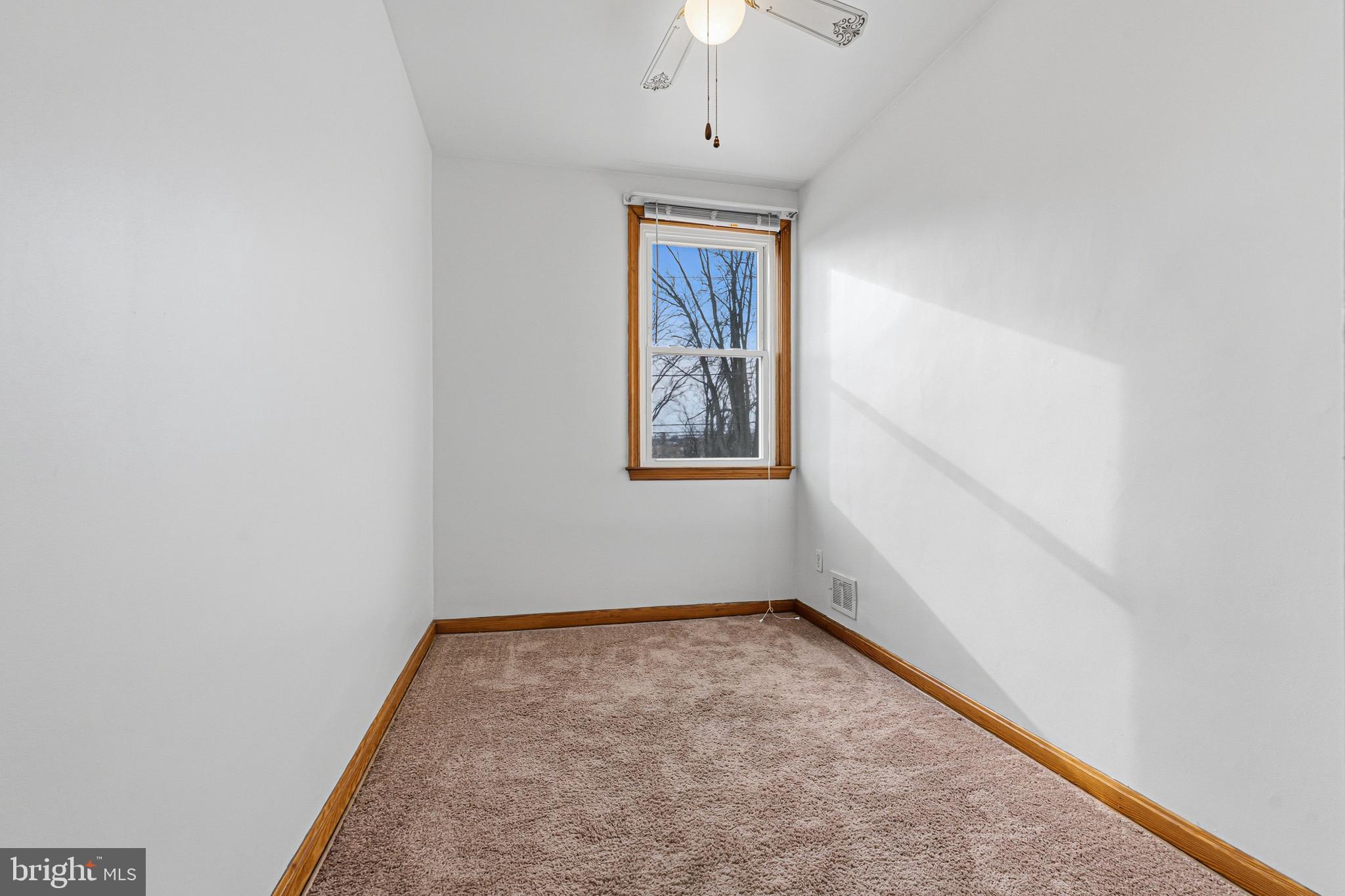1242 Delbert Avenue Baltimore, MD 21222 - Photo 10 of 34 an empty room with windows