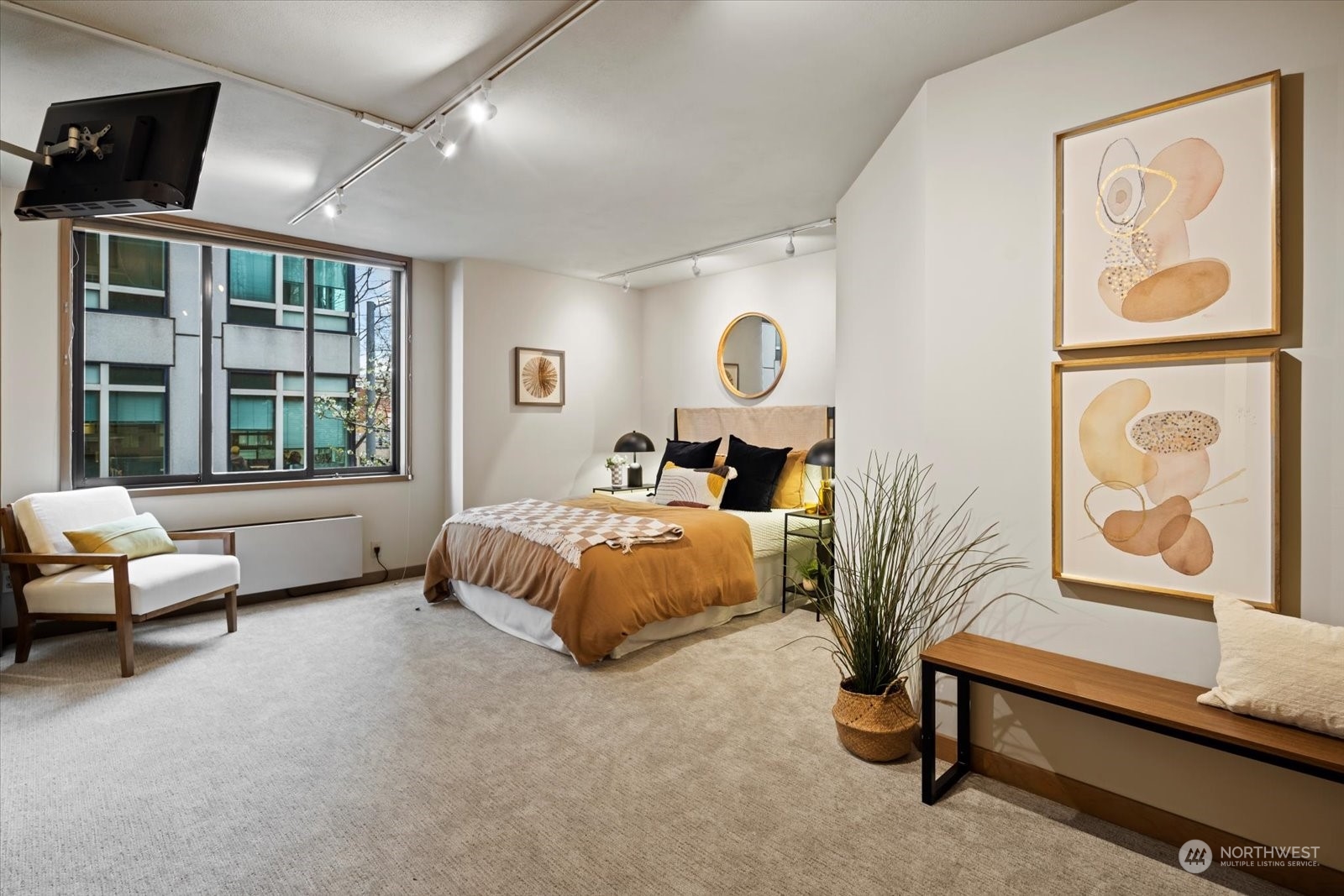 2021 1st Avenue, Unit G2 Seattle, WA 98121 - Photo 11 of 24 a spacious bedroom with a bed and a couch