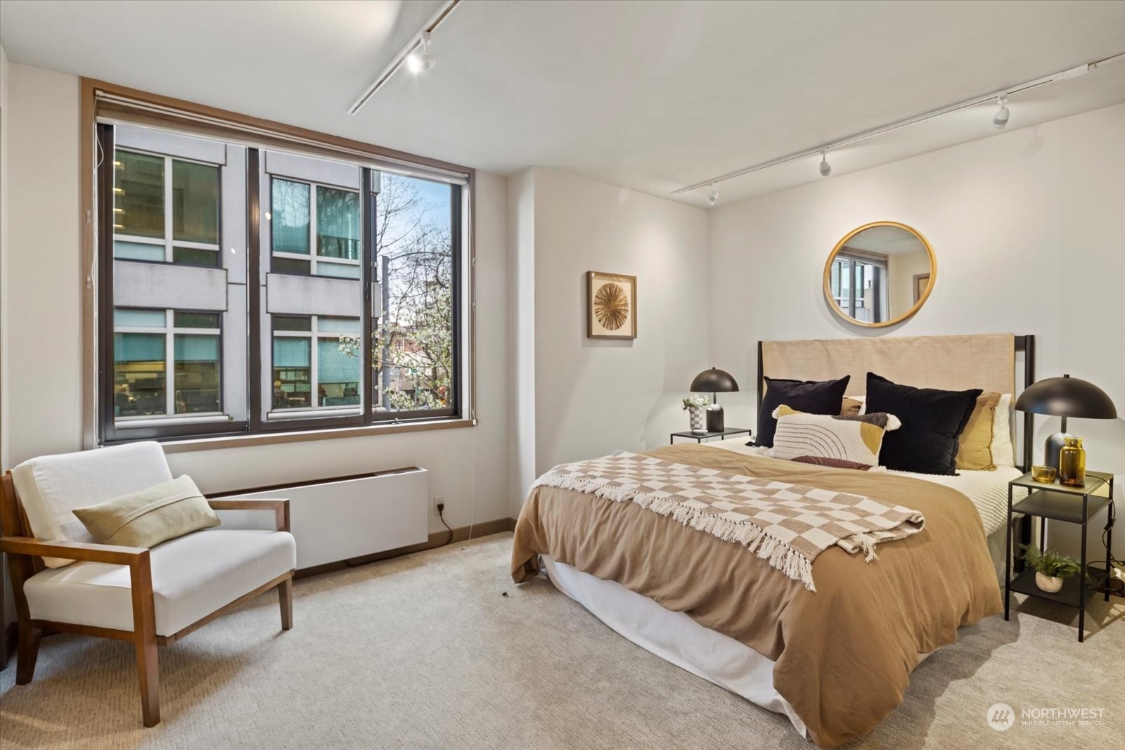 2021 1st Avenue, Unit G2 Seattle, WA 98121 - Photo 12 of 24 a bedroom with a bed and a window