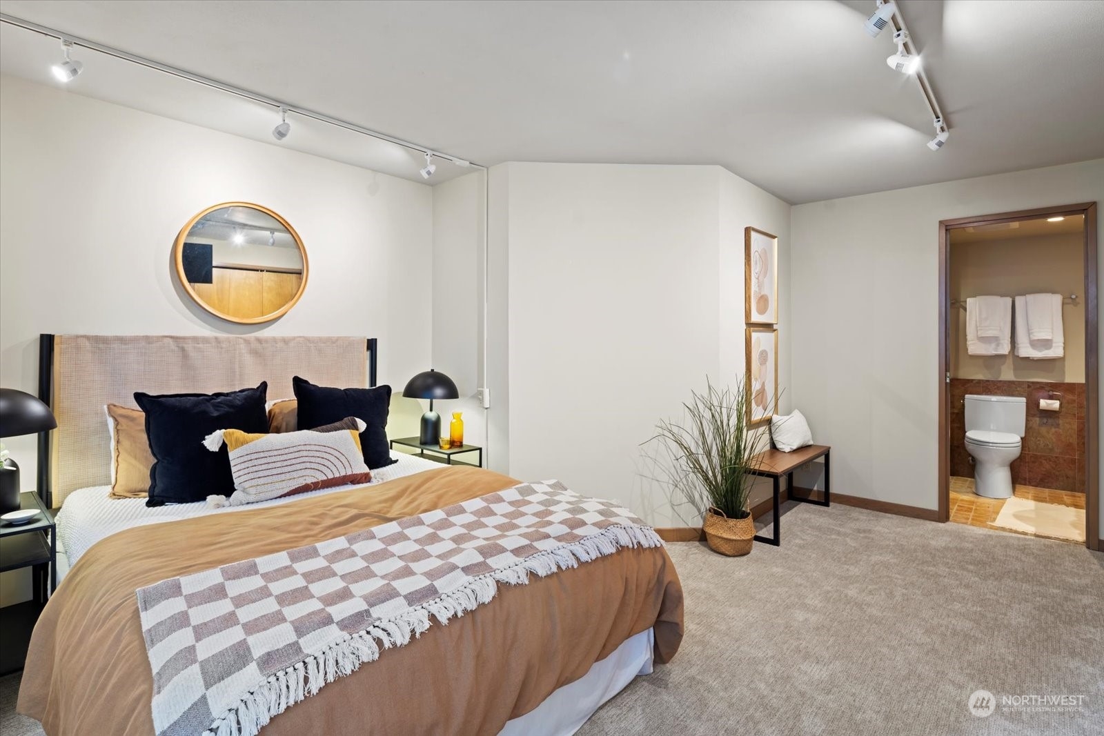 2021 1st Avenue, Unit G2 Seattle, WA 98121 - Photo 14 of 24 a bedroom with bed and a mirror