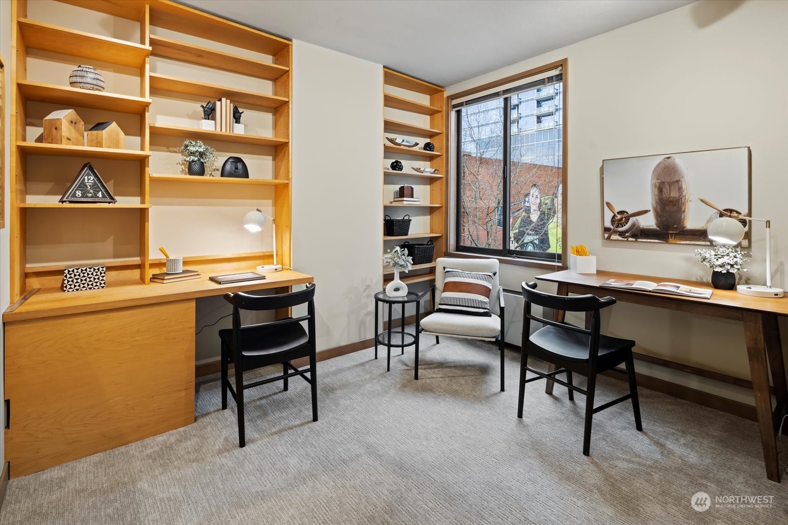 2021 1st Avenue, Unit G2 Seattle, WA 98121 - Photo 16 of 24 a view of a workspace with furniture and a window