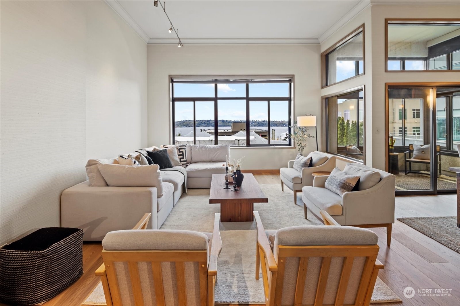 2021 1st Avenue, Unit G2 Seattle, WA 98121 - Photo 3 of 24 a living room with furniture and floor to ceiling windows