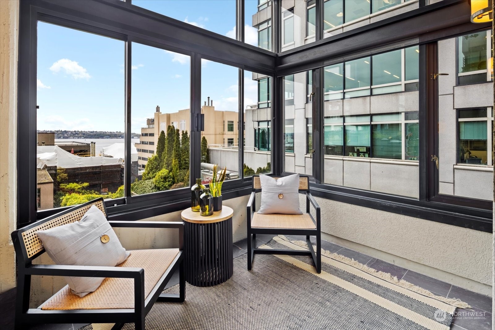 2021 1st Avenue, Unit G2 Seattle, WA 98121 - Photo 6 of 24 a living room with furniture and a floor to ceiling window