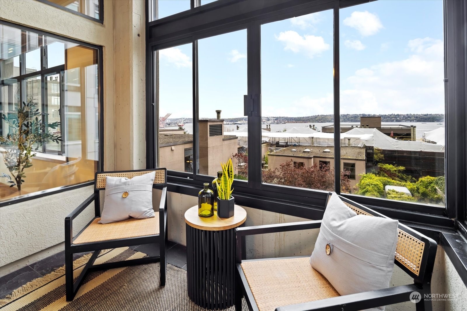 2021 1st Avenue, Unit G2 Seattle, WA 98121 - Photo 7 of 24 a living room with furniture and floor to ceiling windows