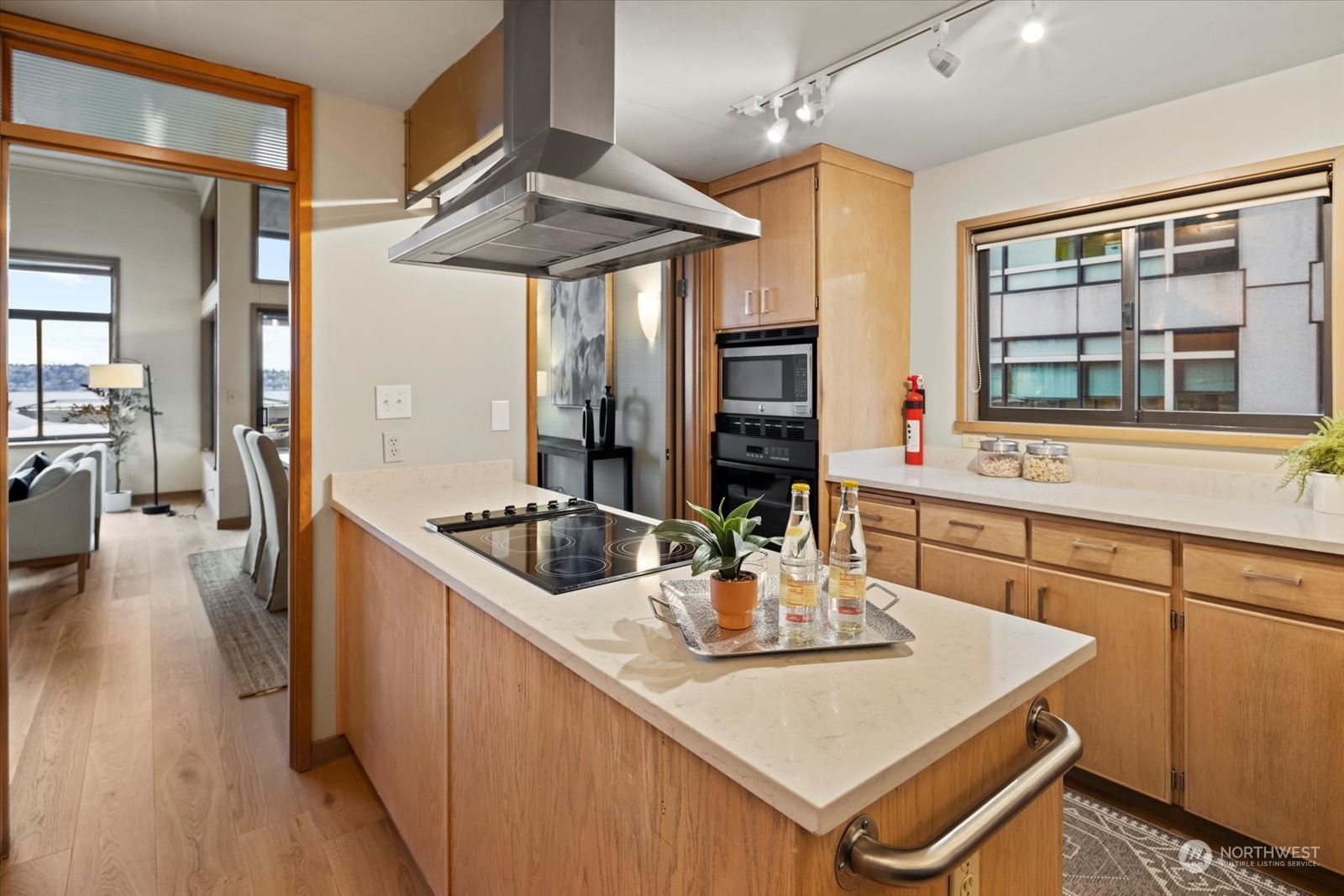 2021 1st Avenue, Unit G2 Seattle, WA 98121 - Photo 8 of 24 a kitchen with a sink a stove and chairs