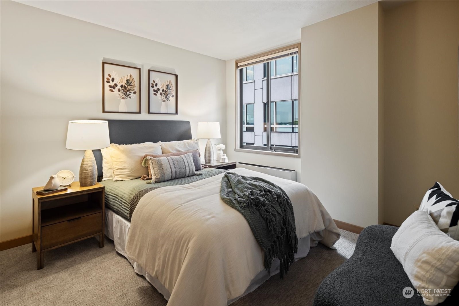 2021 1st Avenue, Unit G2 Seattle, WA 98121 - Photo 10 of 24 a bedroom with a bed and wooden floor