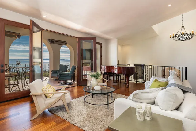 a living room with furniture and a window