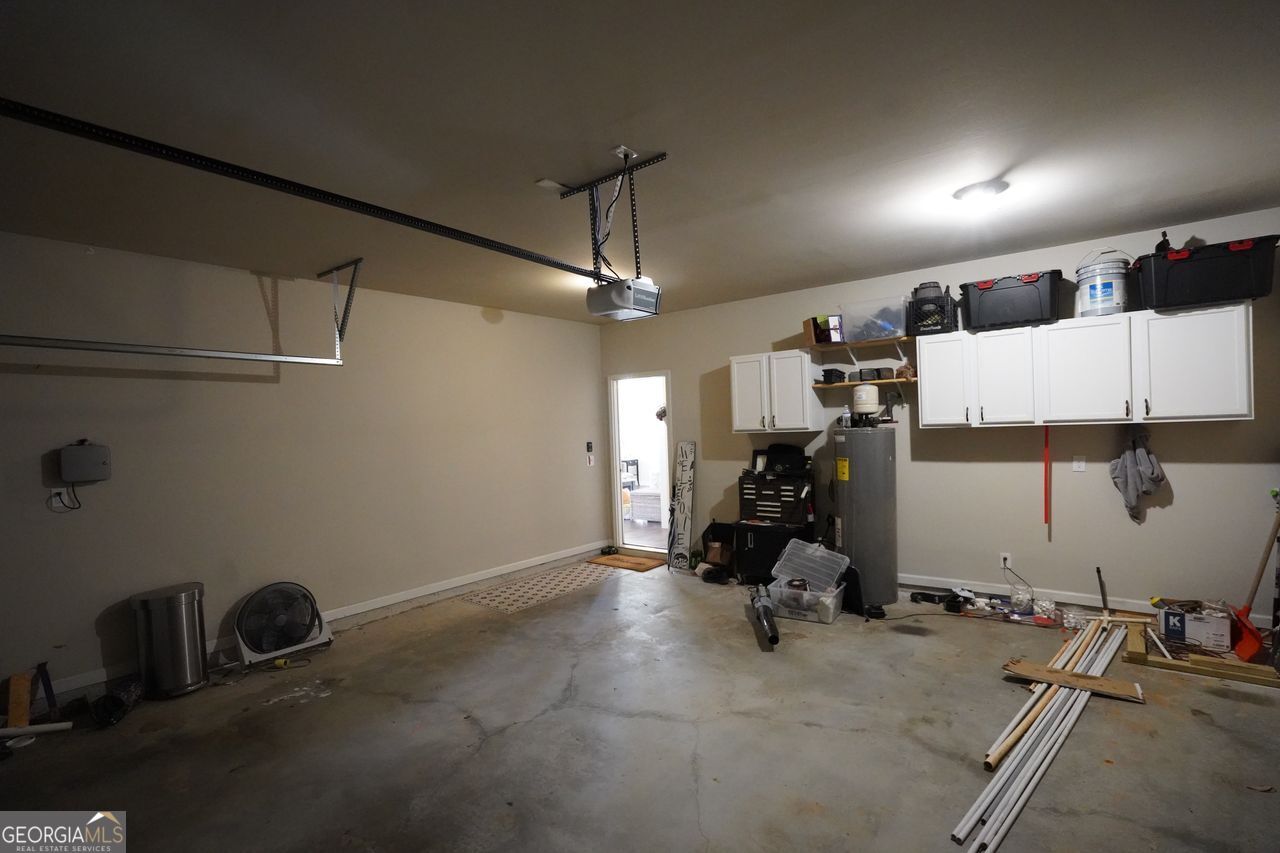 7671 Silk Tree Braselton, GA 30517 - Photo 31 of 92 a view of a room with gym equipment