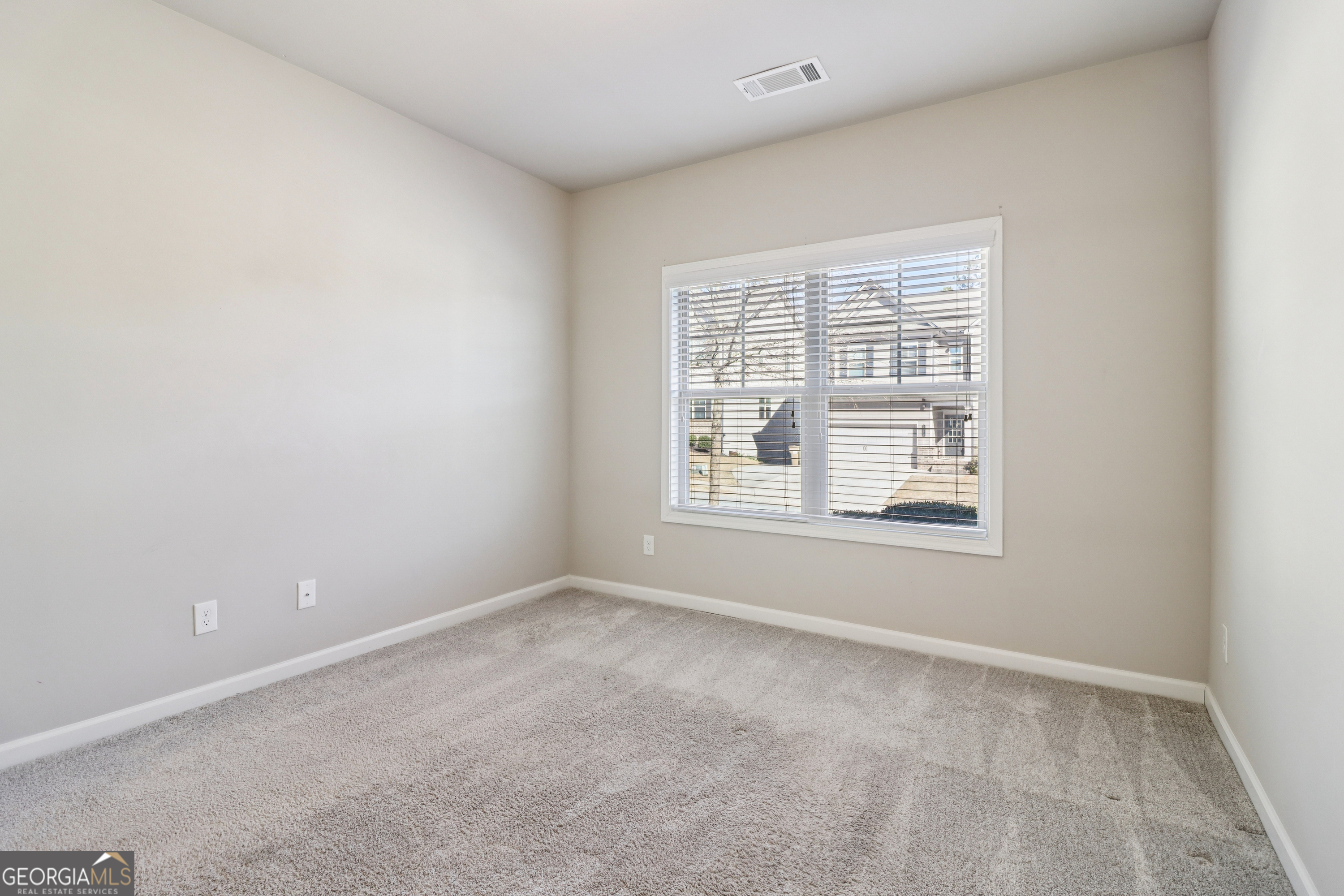 7671 Silk Tree Braselton, GA 30517 - Photo 42 of 92 an empty room with a window