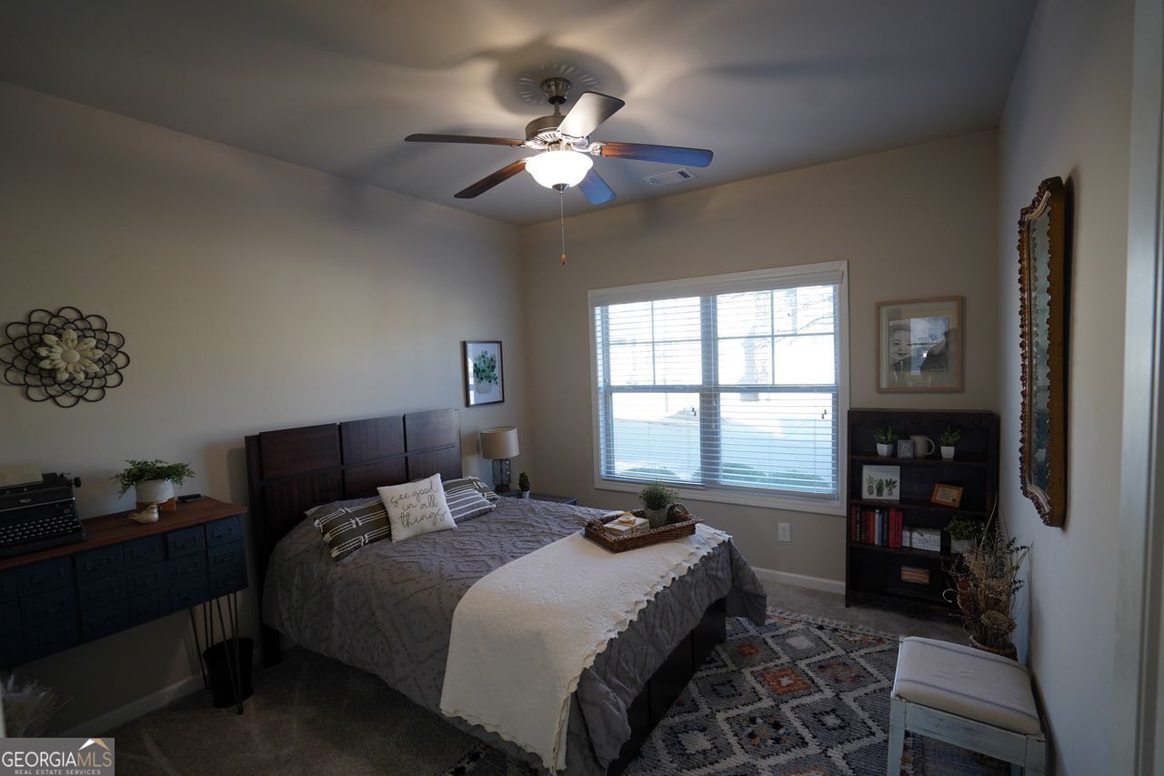 7671 Silk Tree Braselton, GA 30517 - Photo 47 of 92 a bedroom with a bed and a window