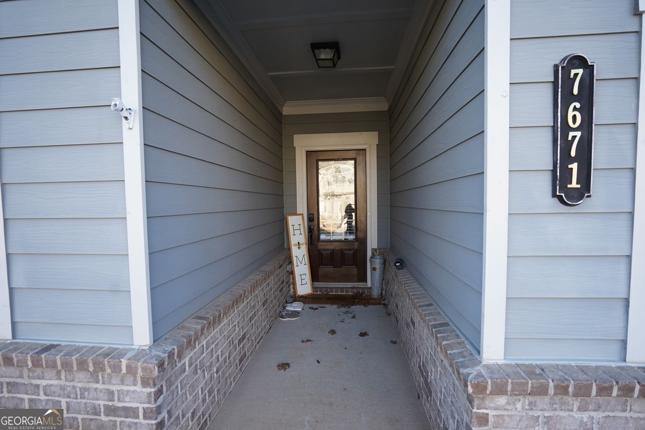7671 Silk Tree Braselton, GA 30517 - Photo 5 of 92 a view of front door of house