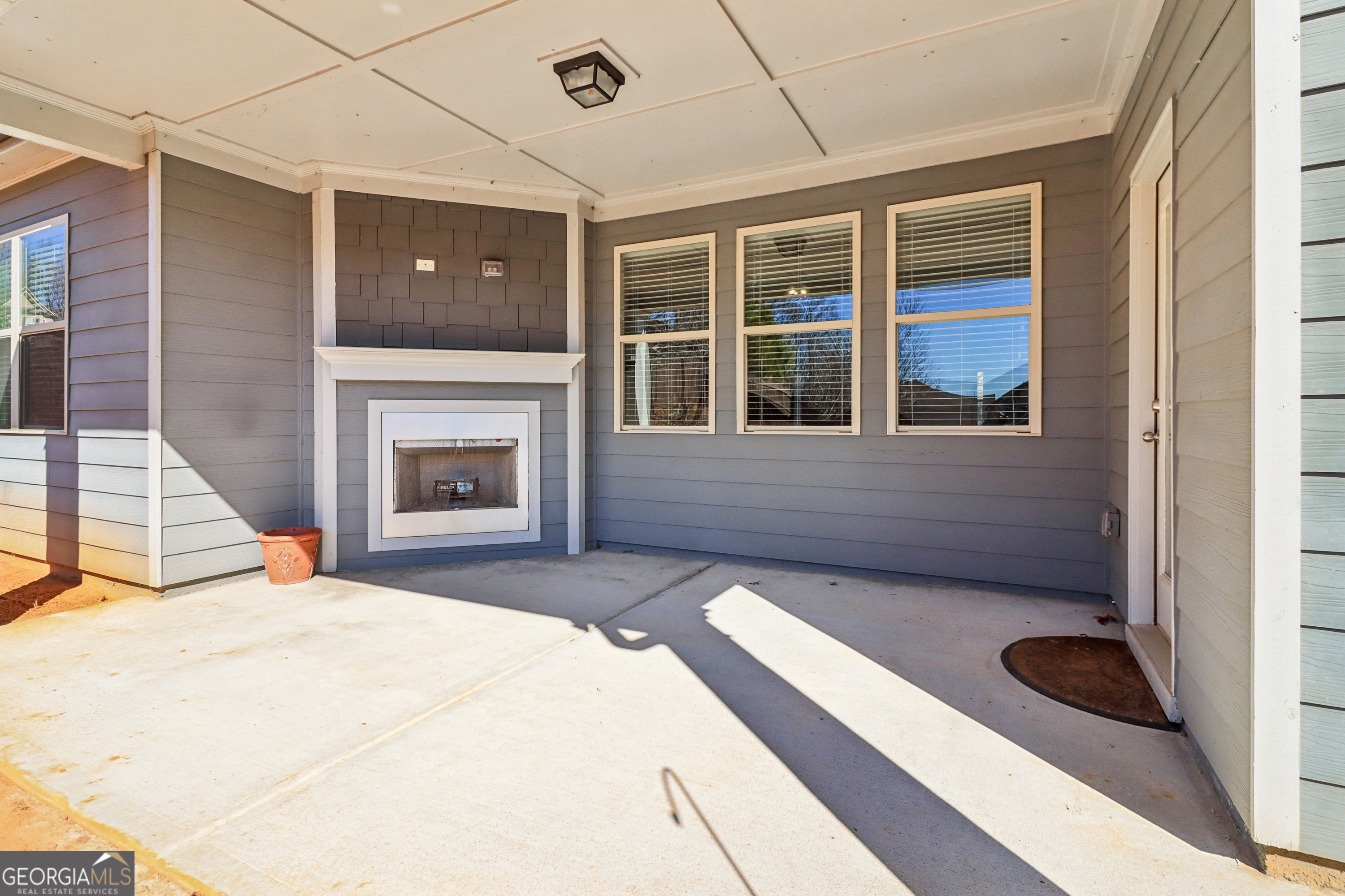 7671 Silk Tree Braselton, GA 30517 - Photo 58 of 92 a bedroom with a bed and a fireplace