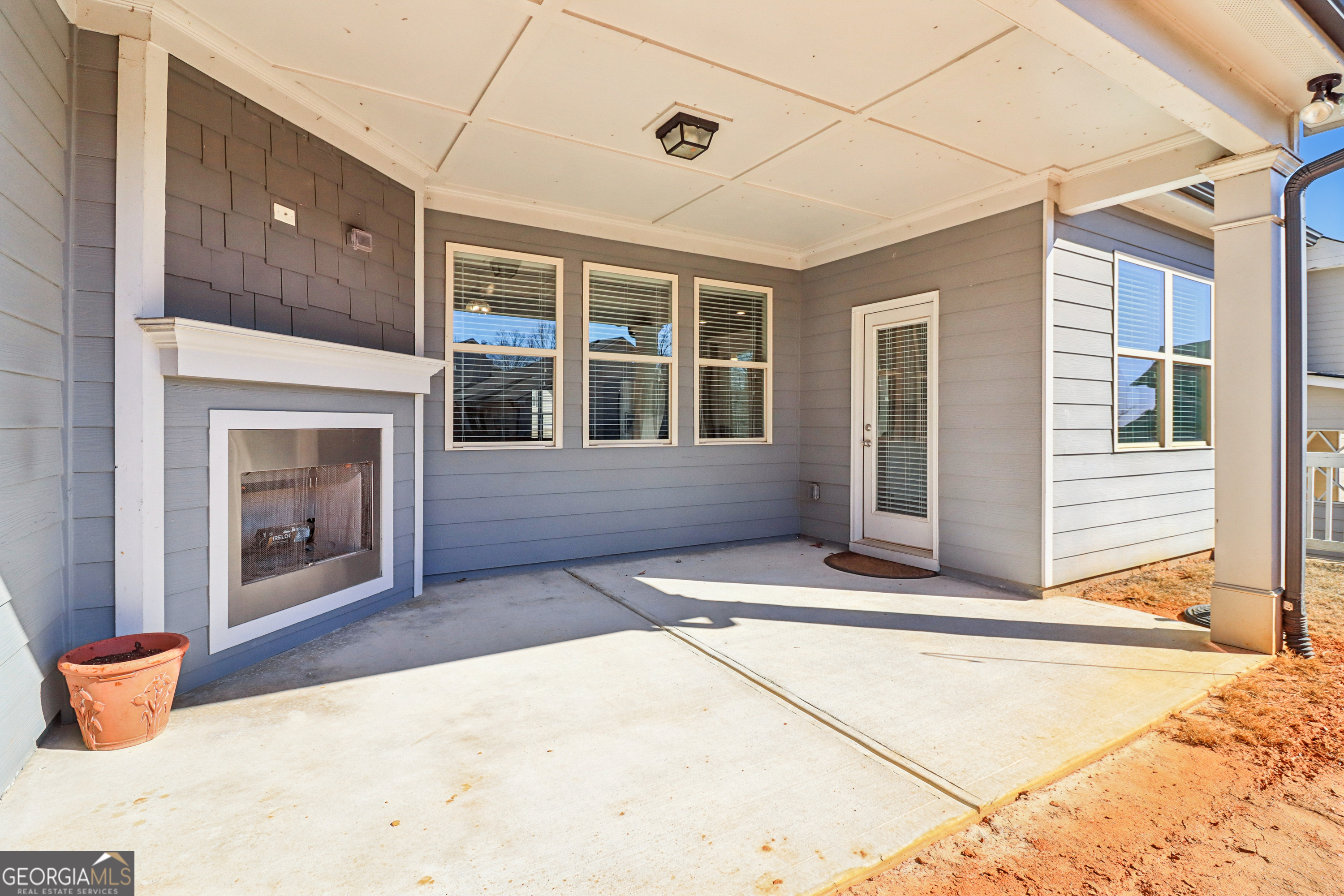7671 Silk Tree Braselton, GA 30517 - Photo 60 of 92 a front view of a house with large windows
