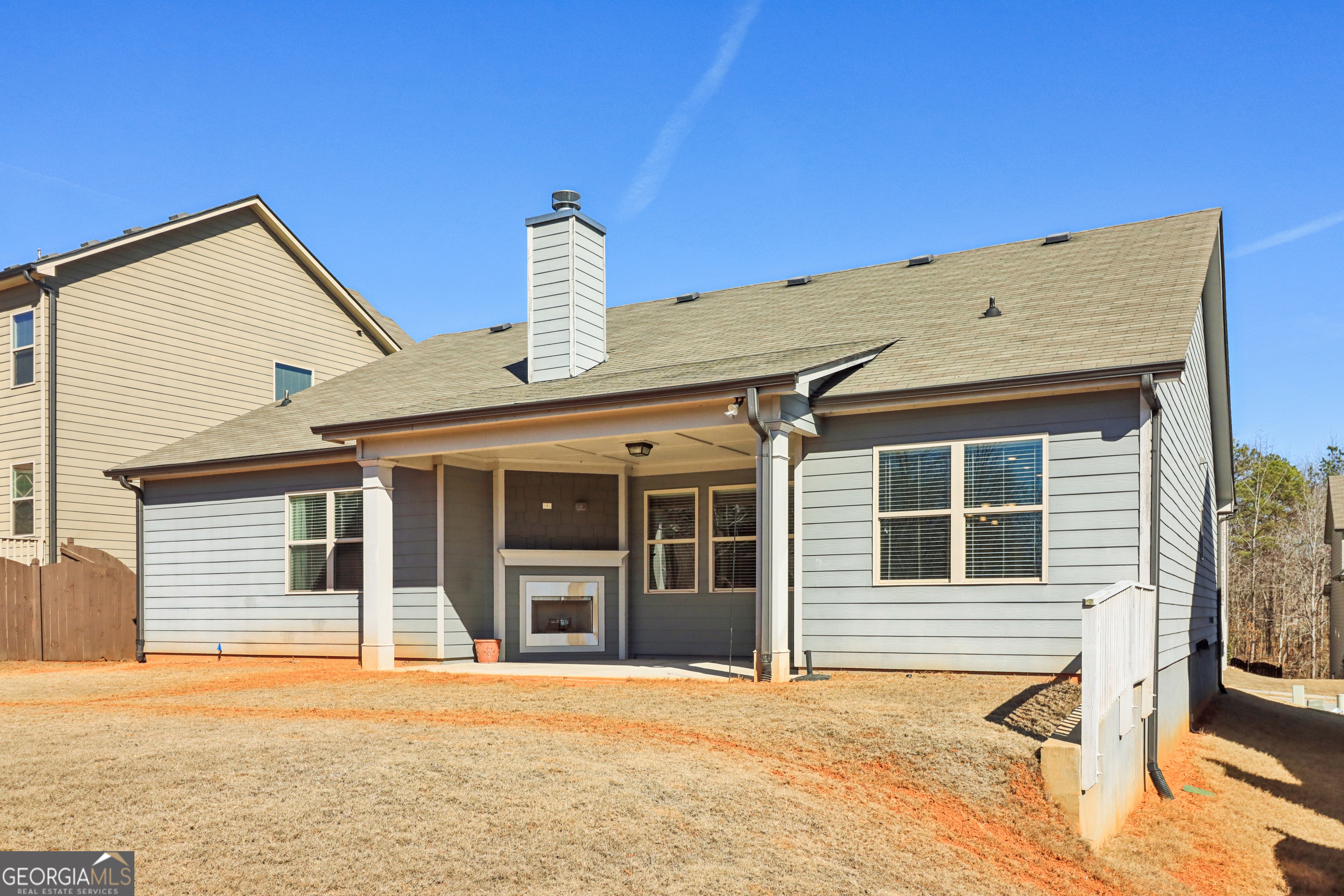 7671 Silk Tree Braselton, GA 30517 - Photo 64 of 92 a front view of a house with windows