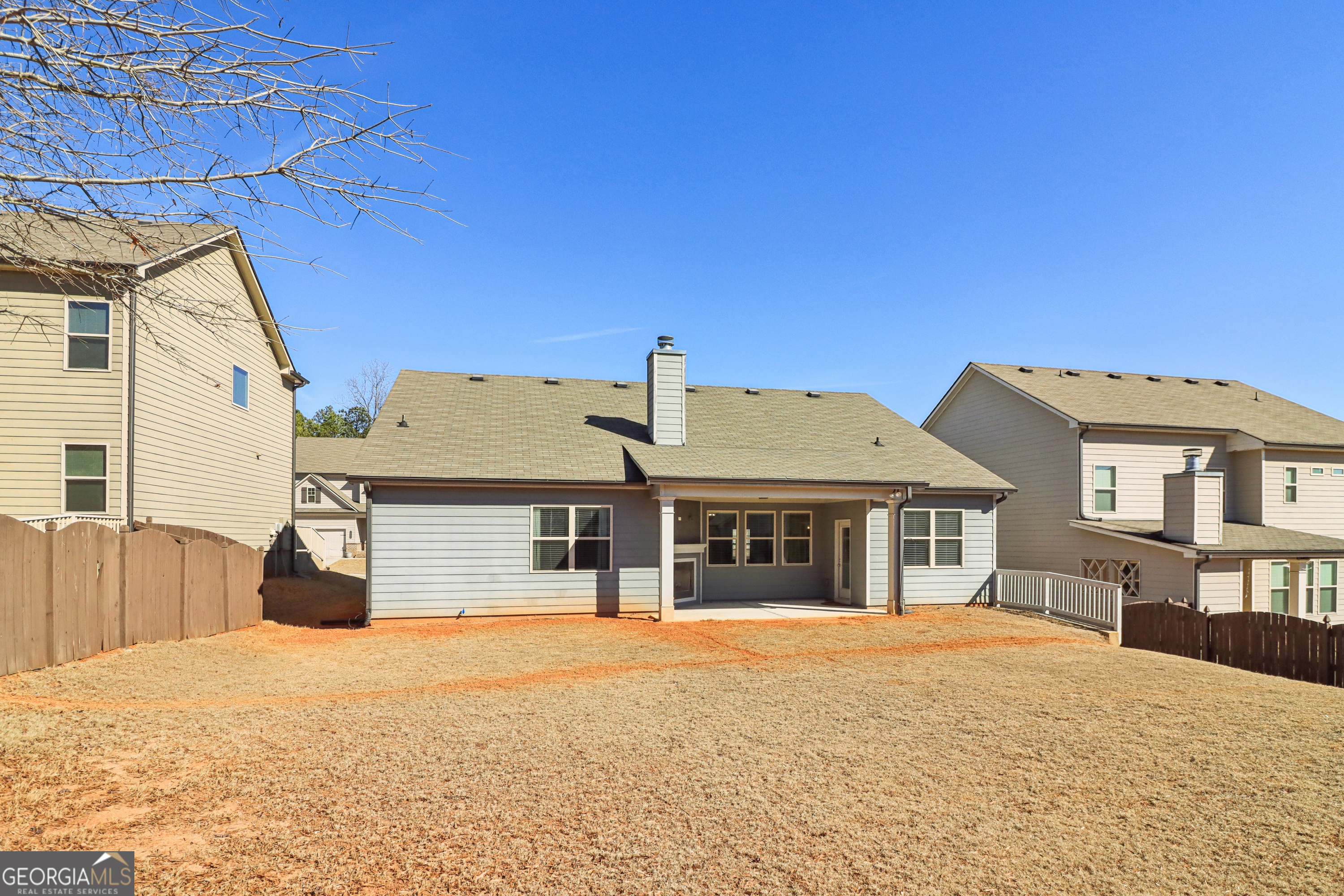 7671 Silk Tree Braselton, GA 30517 - Photo 68 of 92 a front view of a house with a yard