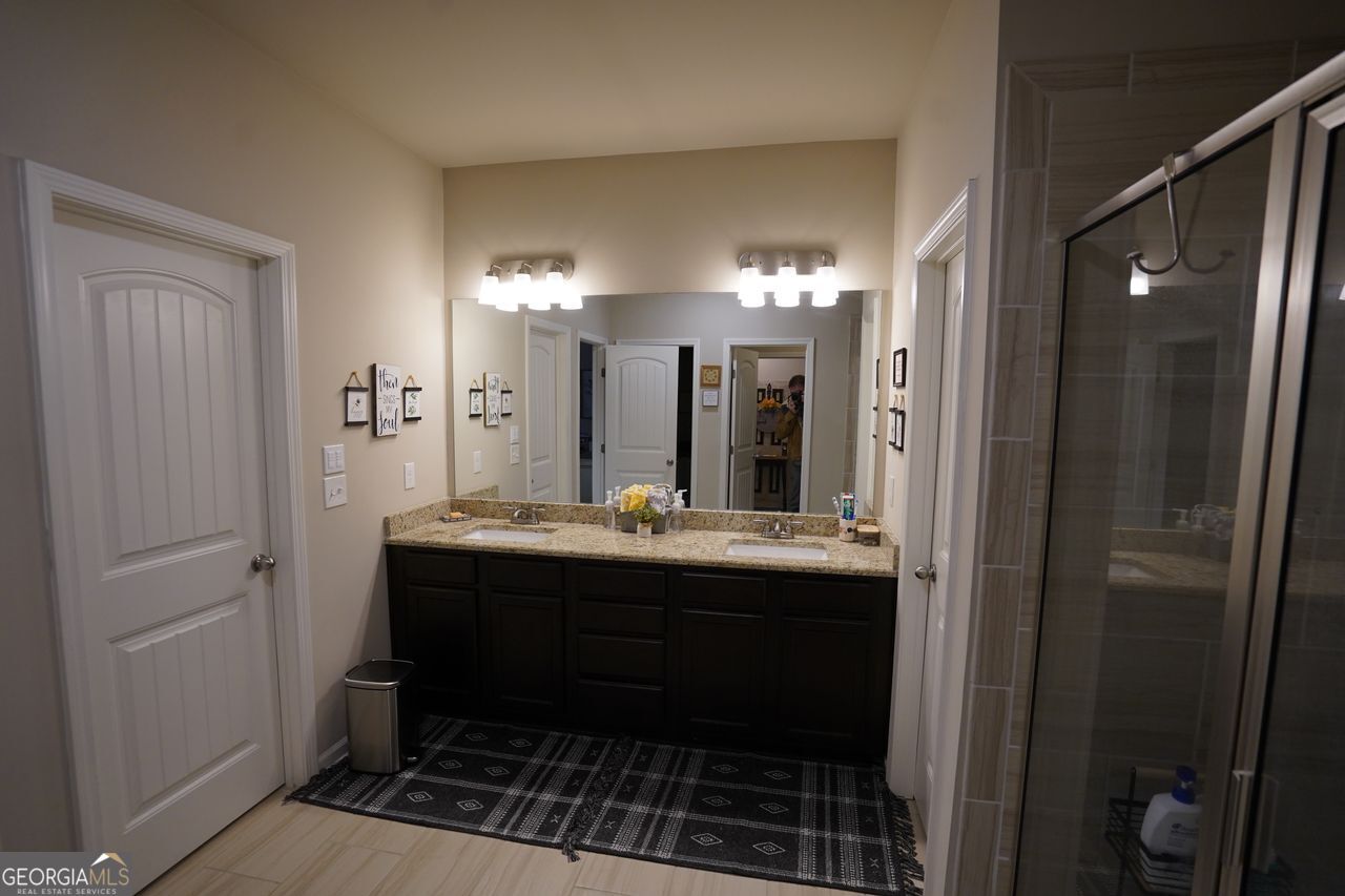 7671 Silk Tree Braselton, GA 30517 - Photo 75 of 92 a bathroom with a sink and a mirror