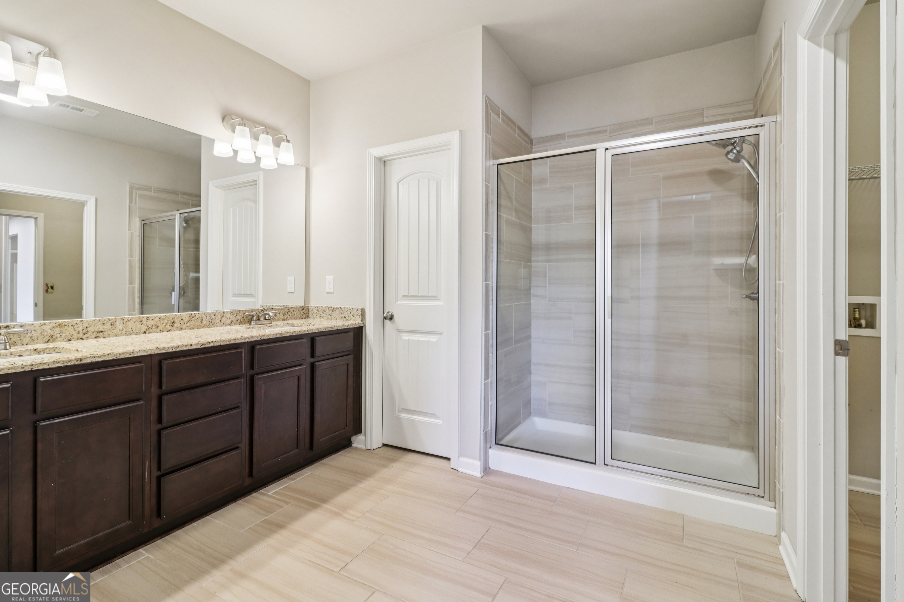 7671 Silk Tree Braselton, GA 30517 - Photo 88 of 92 a bathroom with a double vanity sink and mirror