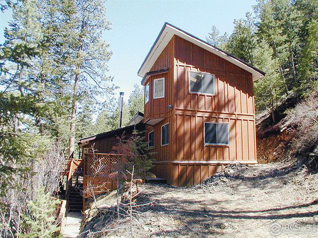 9431 Rist Canyon Road Bellvue, CO 80512 - Photo 14 of 15 a view of a house with a yard
