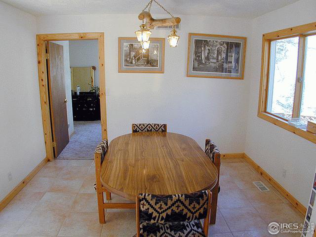 9431 Rist Canyon Road Bellvue, CO 80512 - Photo 10 of 15 a bedroom with a bed and a mirror