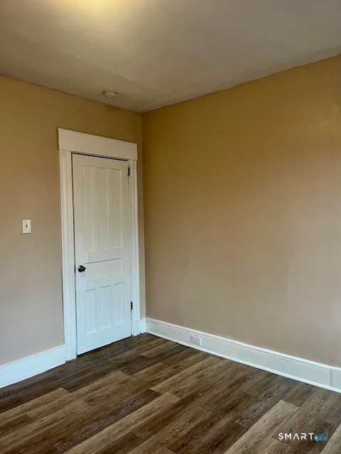 166 Laurel Avenue Bridgeport, CT 06605 - Photo 14 of 15 a view of empty room with wooden floor and fan