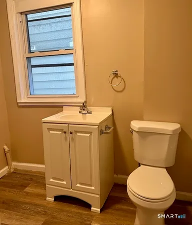 a bathroom with a toilet and a sink