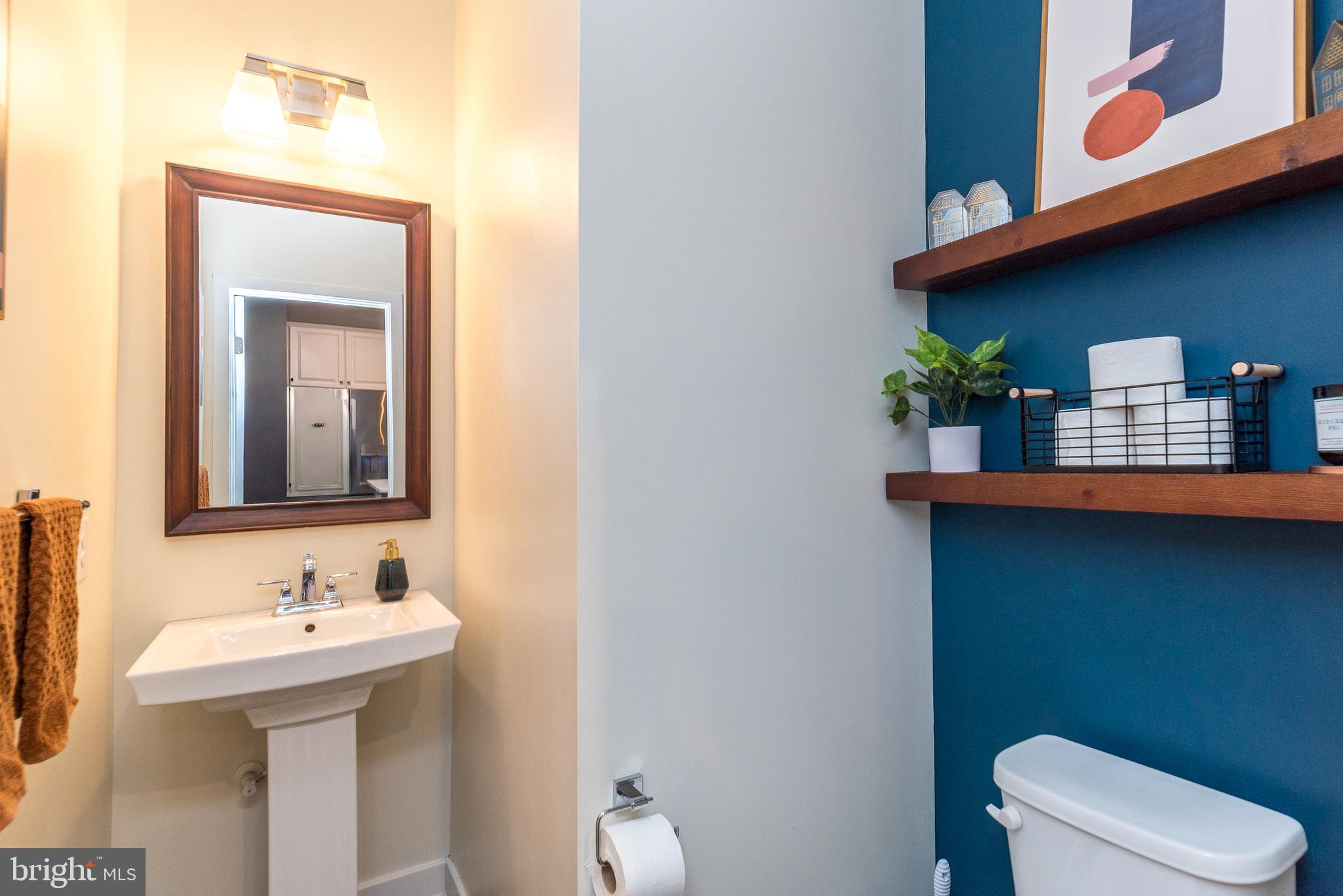 121 Arbor Boulevard Perkasie, PA 18944 - Photo 11 of 39 a bathroom with a toilet sink and mirror