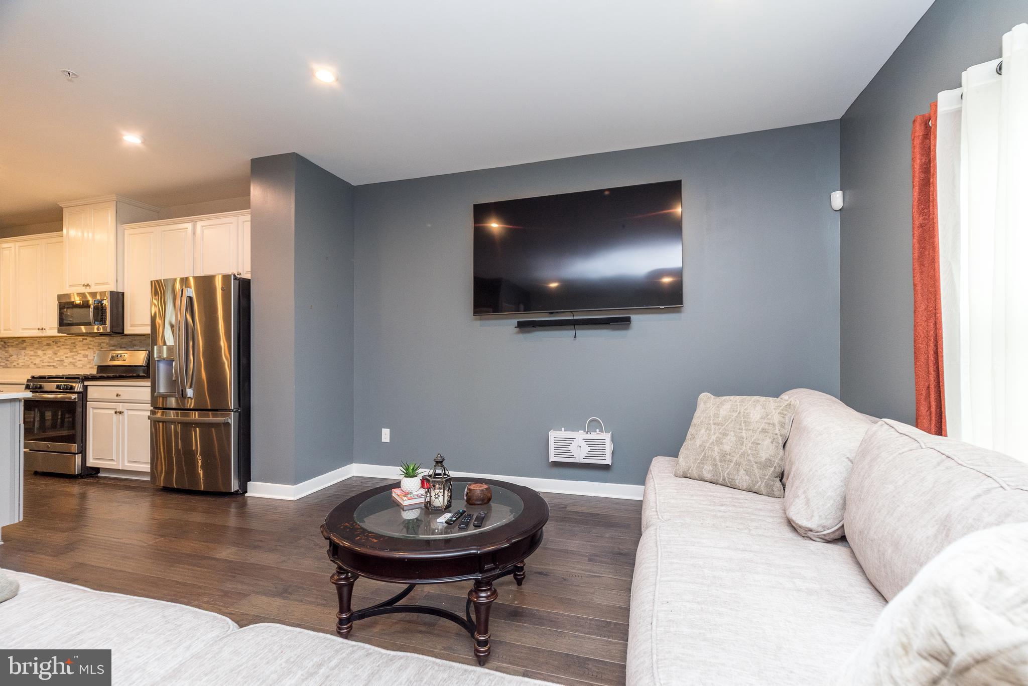 121 Arbor Boulevard Perkasie, PA 18944 - Photo 14 of 39 a living room with furniture and a flat screen tv