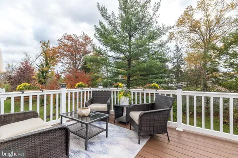 a view of a chair and table on the wooden floor