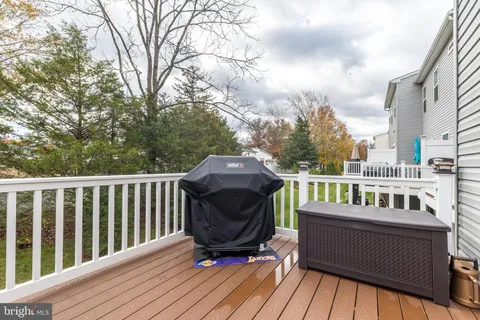 a view of a balcony with two chairs and a table