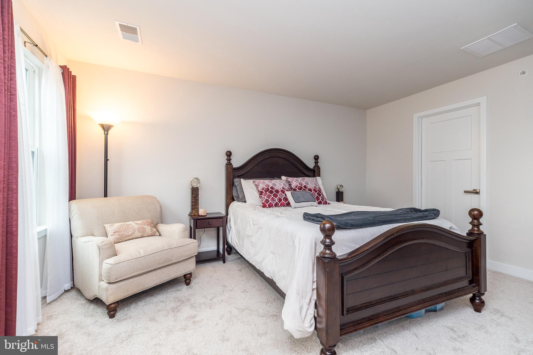 121 Arbor Boulevard Perkasie, PA 18944 - Photo 24 of 39 a bedroom with a bed and a couch