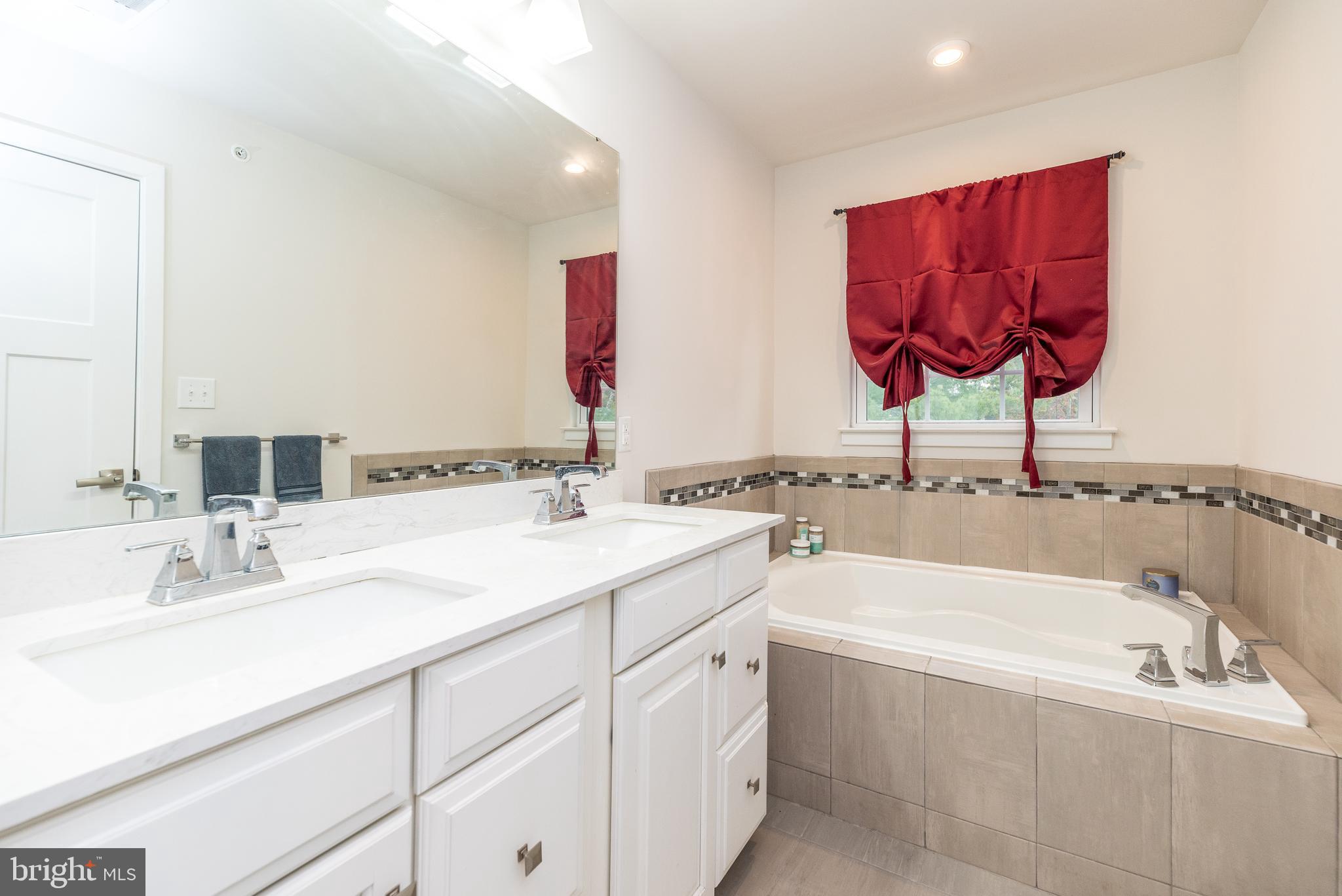 121 Arbor Boulevard Perkasie, PA 18944 - Photo 26 of 39 a bathroom with a sink and a bathtub