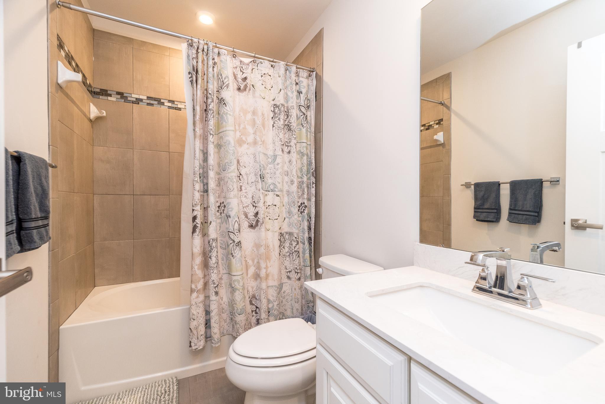 121 Arbor Boulevard Perkasie, PA 18944 - Photo 29 of 39 a bathroom with a granite countertop sink toilet and shower