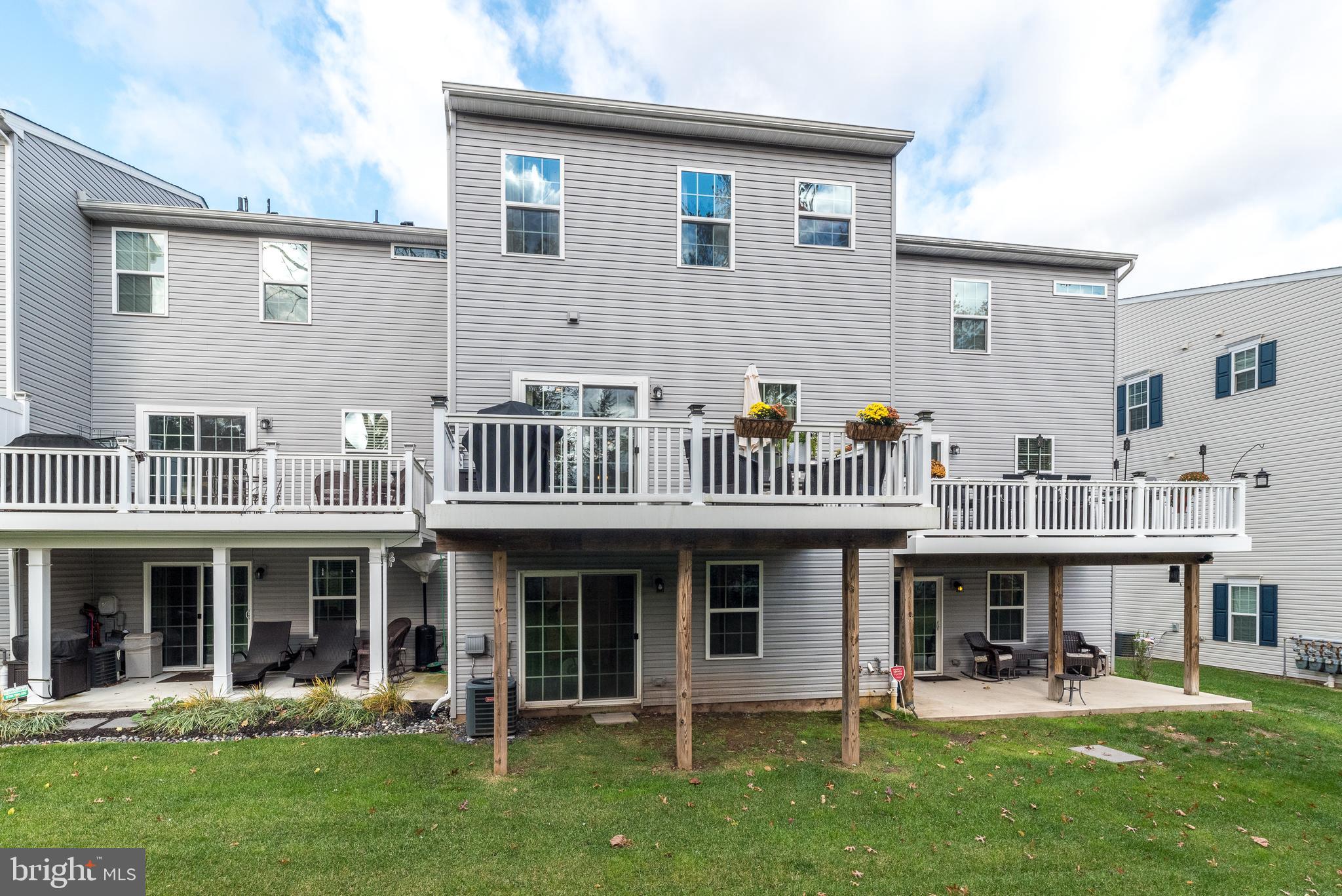 121 Arbor Boulevard Perkasie, PA 18944 - Photo 37 of 39 a view of a building with a yard and sitting area