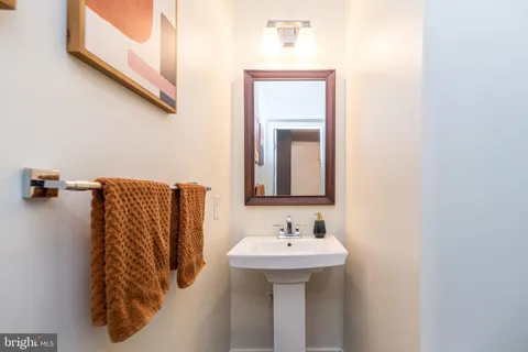 a bathroom with a sink and mirror