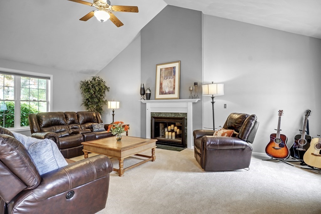 3 Stable Road Nashua, NH 03062 - Photo 8 of 32 a living room with furniture and a fireplace