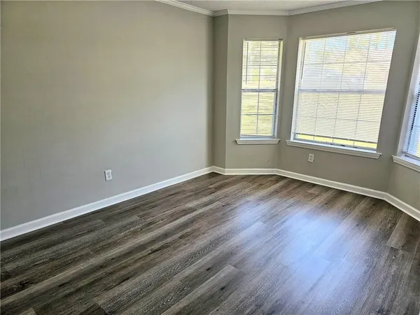 a view of a room with wooden floor and closet