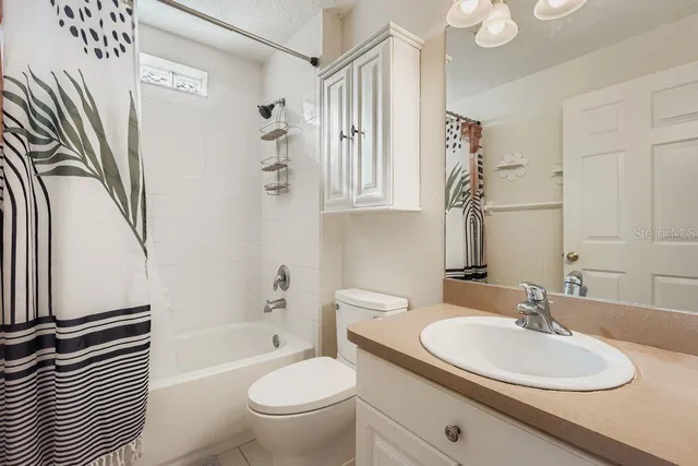 a bathroom with a sink a toilet and a bathtub