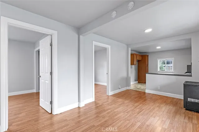 a view of livingroom with hardwood floor and hallway
