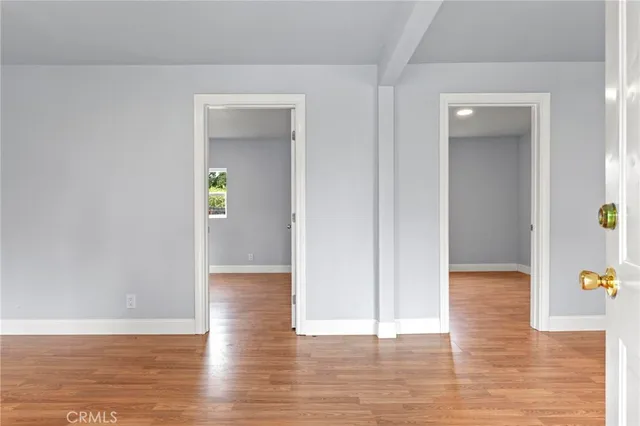 a view of hallway with wooden floor