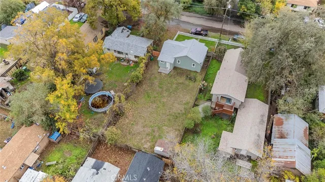 an aerial view of residential house with outdoor space and parking