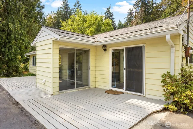 a view of a house with a wooden deck