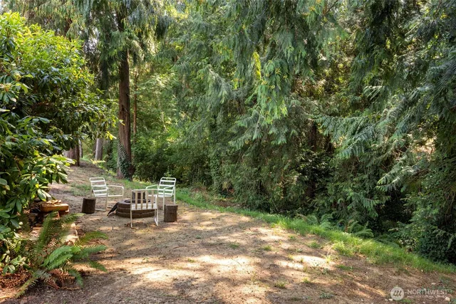 a view of backyard with seating space