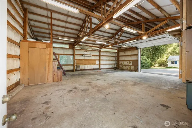 a view of empty room with wooden walls