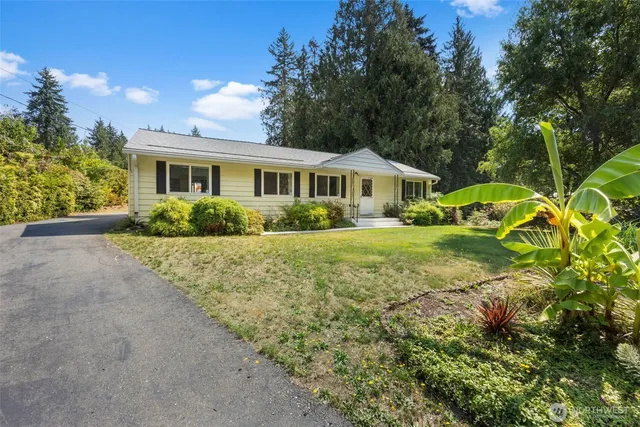 a view of front of house with a yard