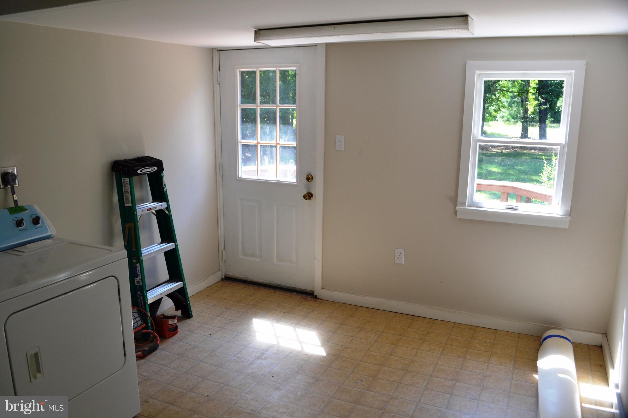 7598 Blueberry Acres Road St. Michaels, MD 21663 - Photo 20 of 30 Laundry Room (main floor) with access to deck
